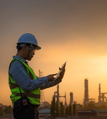 engineer uses tablet to look at CMMS processes
